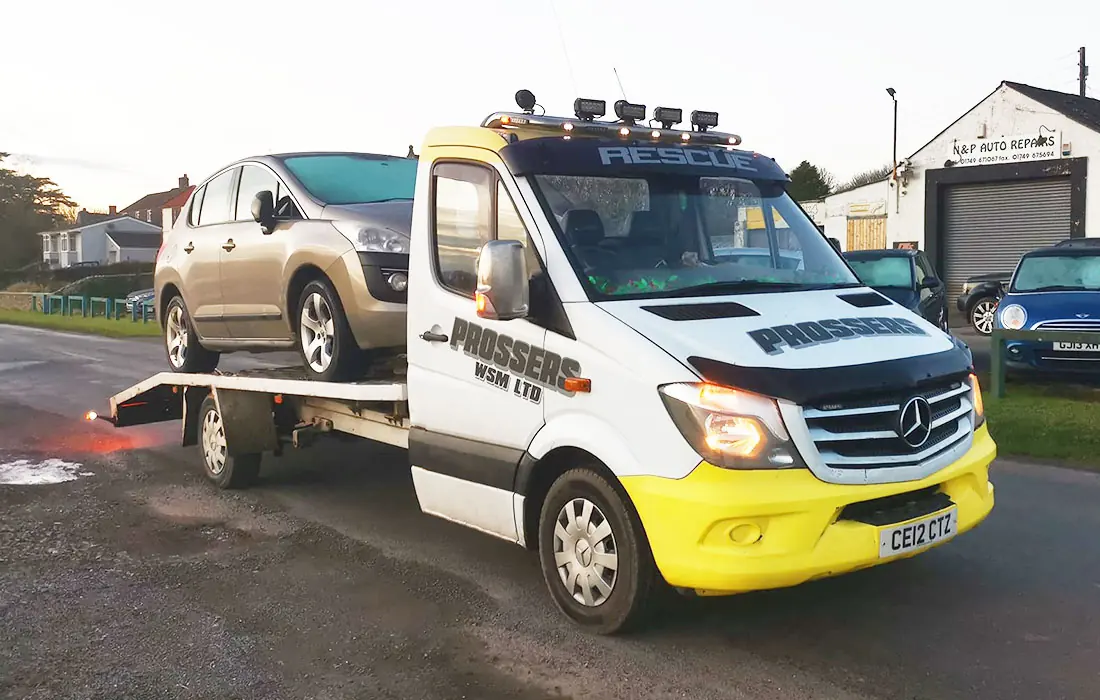 Prossers Mercedes recovery truck carrying a car